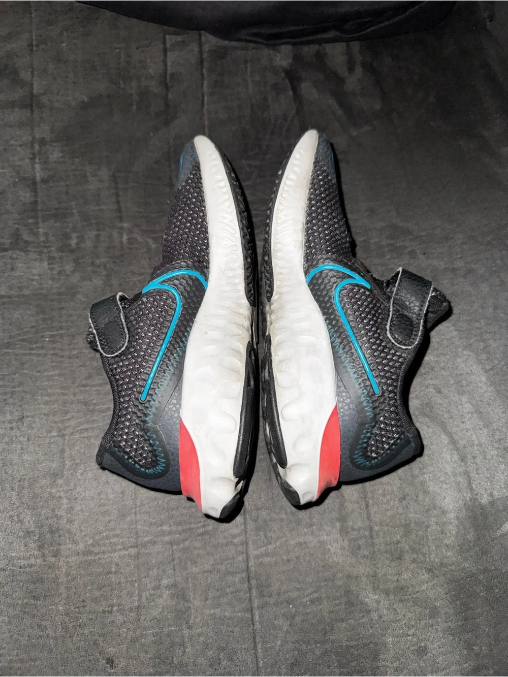 Renew Nike Kids size 13. Running Black Sneakers with Blue and neon pink .